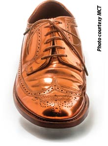  A well polished shinny copper color men dress shoe.