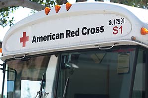 The front of an American Red cross Blood Mobile with the red cross symbol.